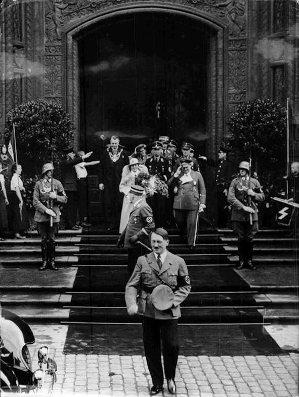 Adolf Hitler leaves Berlin's Rathaus after the civil wedding of the Görings